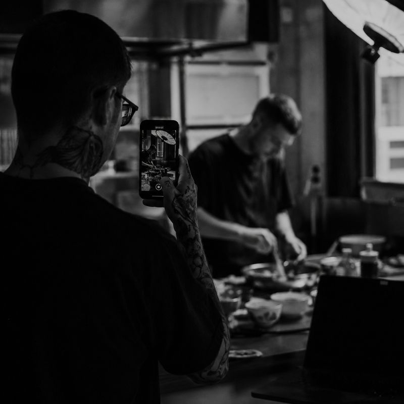 Filming a chef at work on a phone